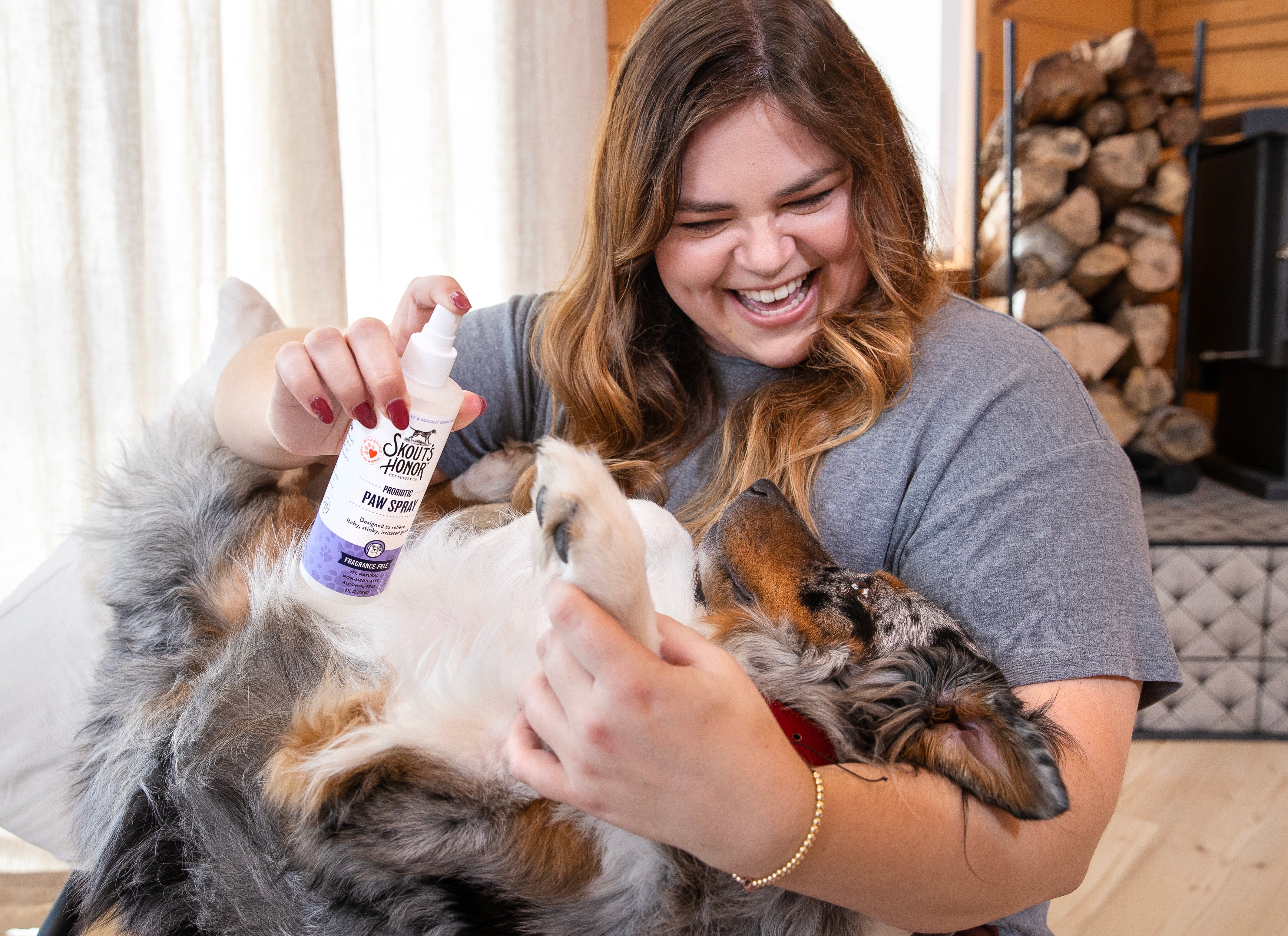 Woman cleaning dog's paws